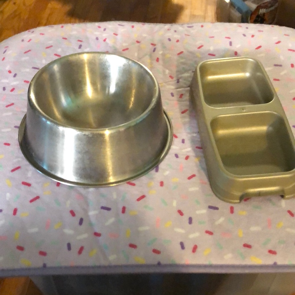 Metal pet food bowl and a plastic pet food dish